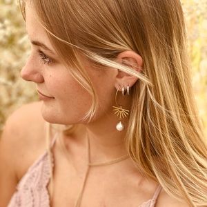 Artist made sunburst brass earring with naturally formed baroque pearl